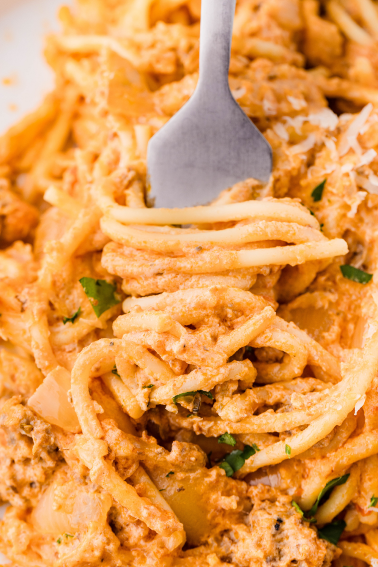 Homemade Fazoli’s-style spaghetti sauce simmering in a pot with rich tomatoes, Italian herbs, and savory seasoning, served over pasta.