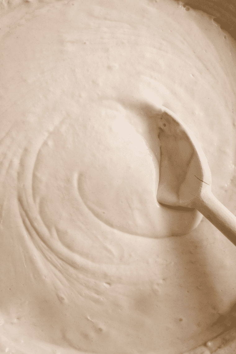 Combining wet and dry ingredients pancake batter forming.