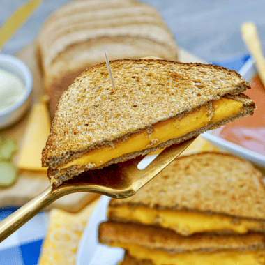 Golden grilled cheese sandwich made with sourdough bread, crispy buttered exterior, and melted cheese inside, inspired by First Watch.