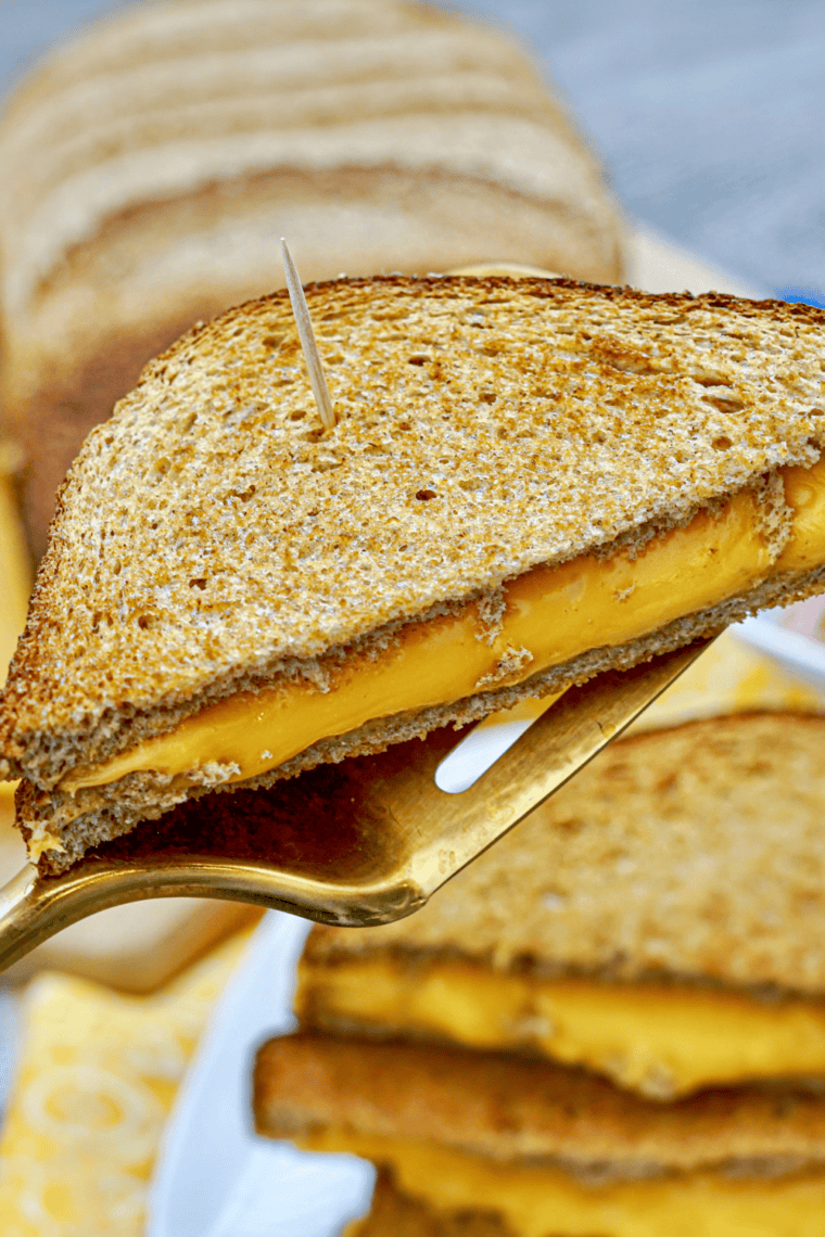 Golden grilled cheese sandwich made with sourdough bread, crispy buttered exterior, and melted cheese inside, inspired by First Watch.