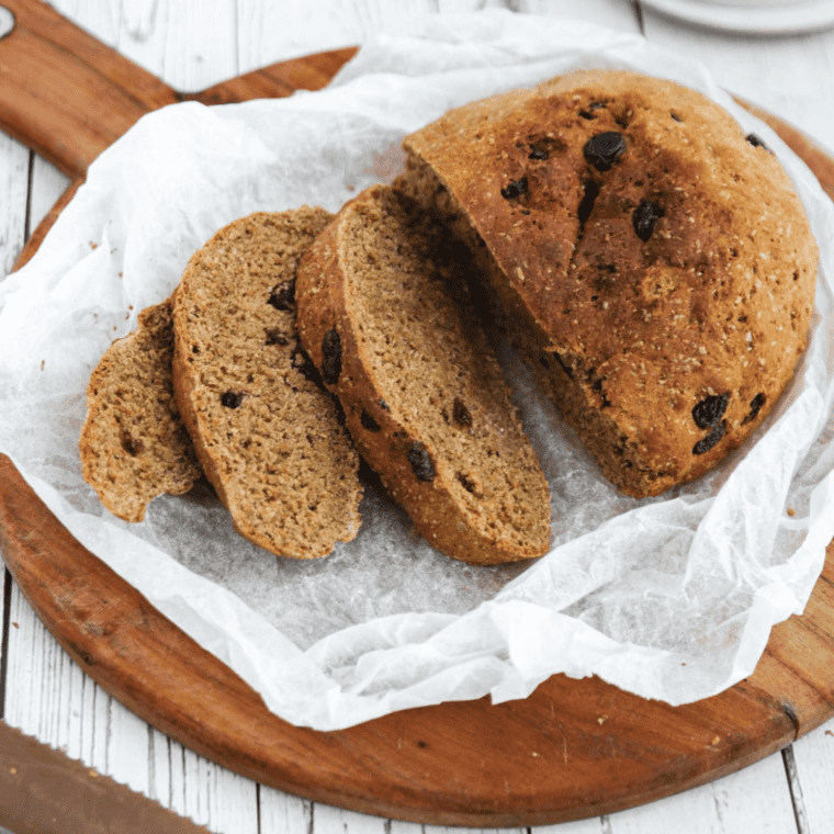 Bread cooling on wire rack before slicing, ready to serve with butter or jam.