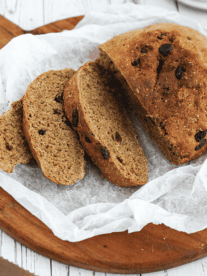 Freshly baked First Watch Multigrain Bread loaf with a golden crust and visible grains, ready to slice and serve.