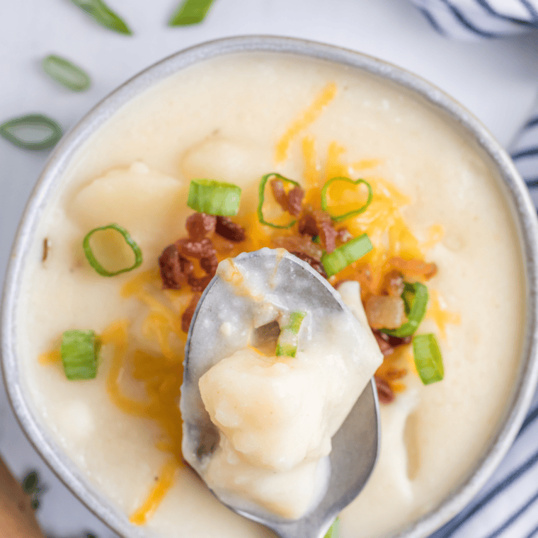 Creamy McAlister’s-style potato soup in a bowl topped with cheese, bacon, and green onions, rich and hearty loaded potato soup copycat recipe.