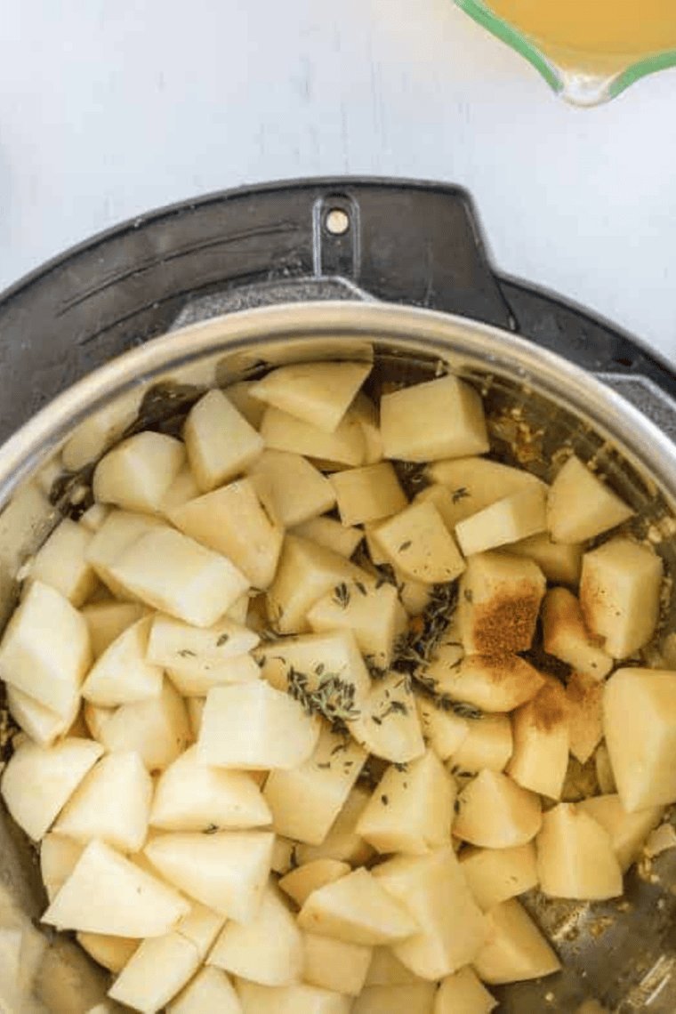 Butter onion and garlic sautéing in Instant Pot creating savory soup base