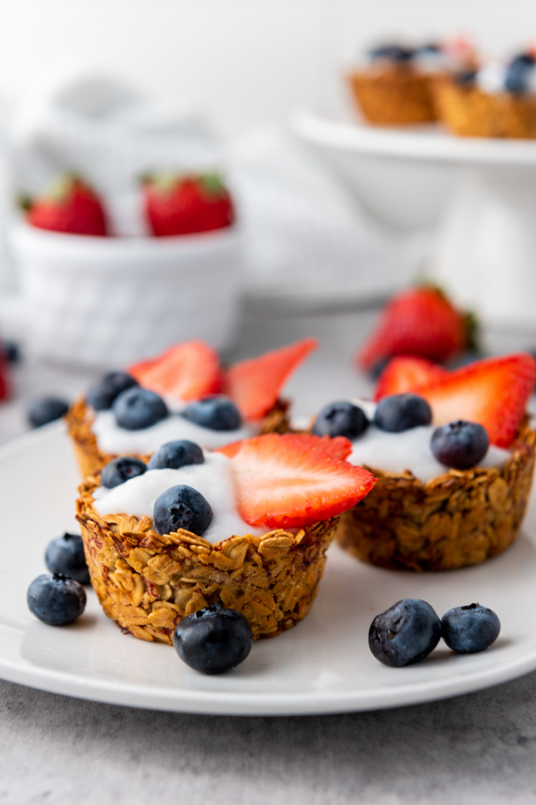 Close up of layered granola berry cups with strawberries blueberries and yogurt for a patriotic dessert