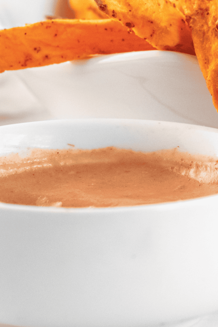 Small bowl of creamy orange-pink Sonic Groovy Sauce served as a dipping sauce for fries and chicken.