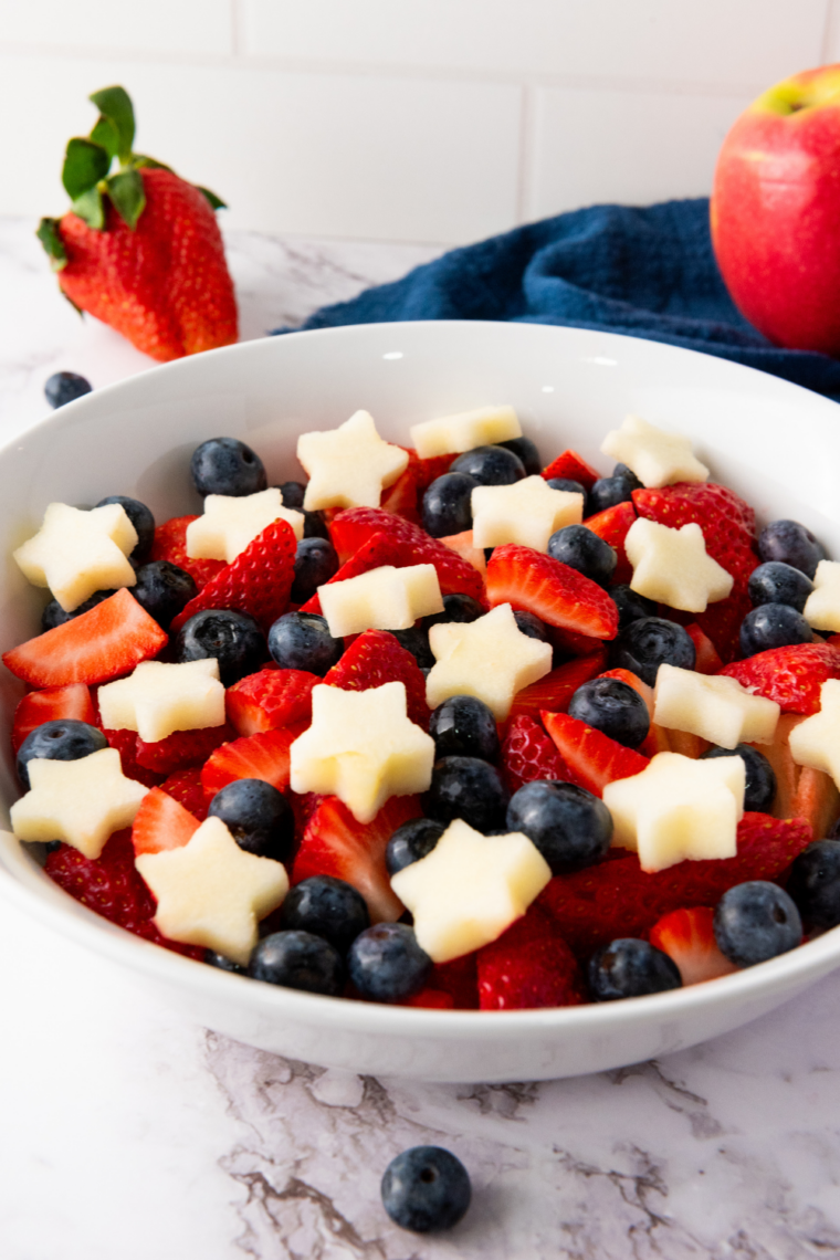 Colorful star-spangled fruit salad arranged with strawberries, blueberries, and star-shaped fruit