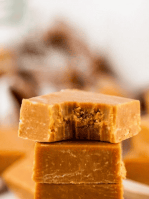 Smooth chocolate fudge shot through with ribbons of buttery caramel, set in a single pan and sliced into rich little squares. This chocolate caramel marble fudge is the dessert that disappears first at every holiday tray, and the whole thing comes together with sweetened condensed milk in about 15 minutes of hands-on work. No candy thermometer, no soft-ball stage, no guesswork.