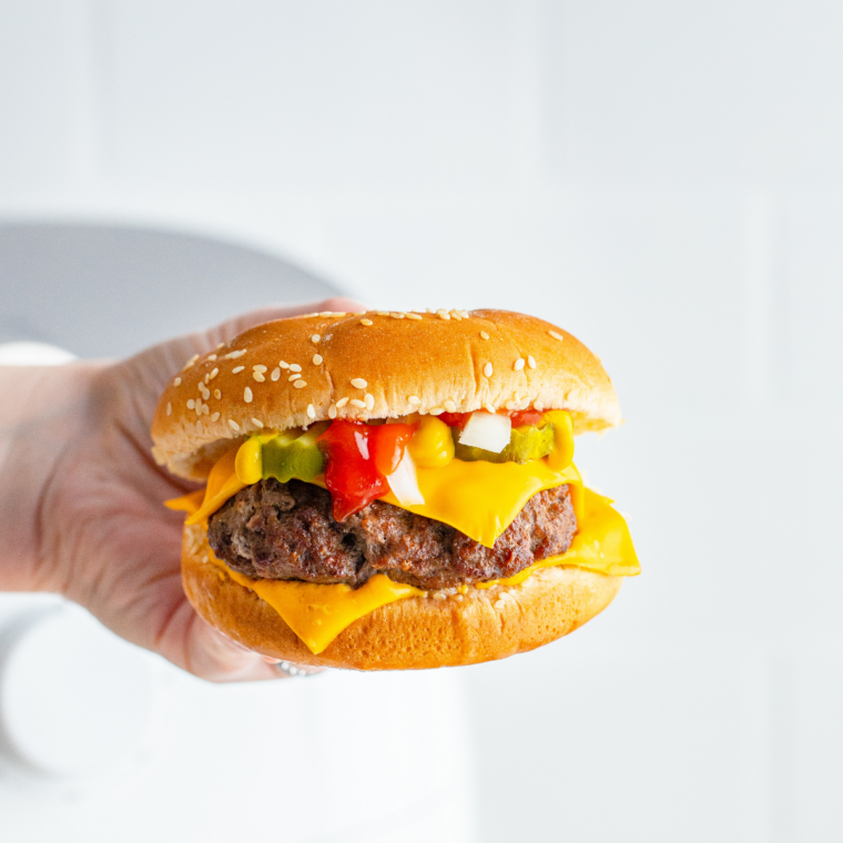 Classic McDonald’s style hamburger with pickles ketchup and soft bun