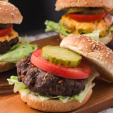 Homemade McDonald’s hamburger on sesame seed bun with pickles and ketchup
