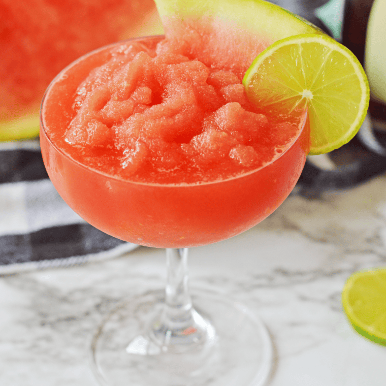 Frosty Ninja Slushi Watermelon Daiquiri garnished with watermelon and lime.