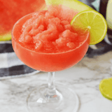 Beat the heat with a Ninja Slushi Watermelon Daiquiri! This refreshing frozen cocktail blends juicy watermelon, white rum, and lime for the ultimate summer slushie made right in your Ninja Slushi machine.