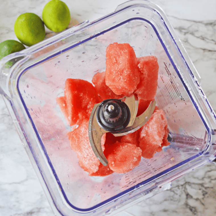 Blending fresh watermelon chunks for a Ninja Slushi Watermelon Daiquiri.