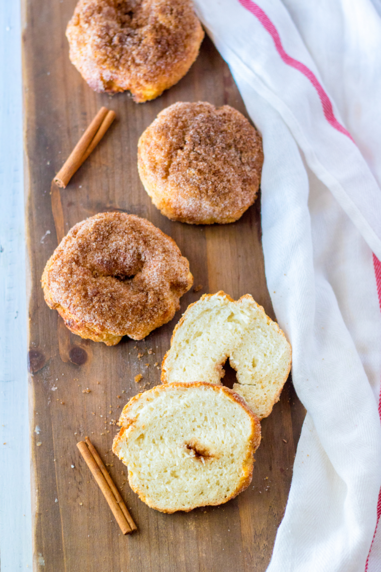 Freshly baked Panera Copycat Cinnamon Crunch Bagels cooling on a wire rack