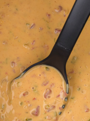 Creamy slow cooker queso with Velveeta, Rotel, and seasoned beef. Ready in 2 hours, stays warm for parties, and only takes 10 minutes of prep!