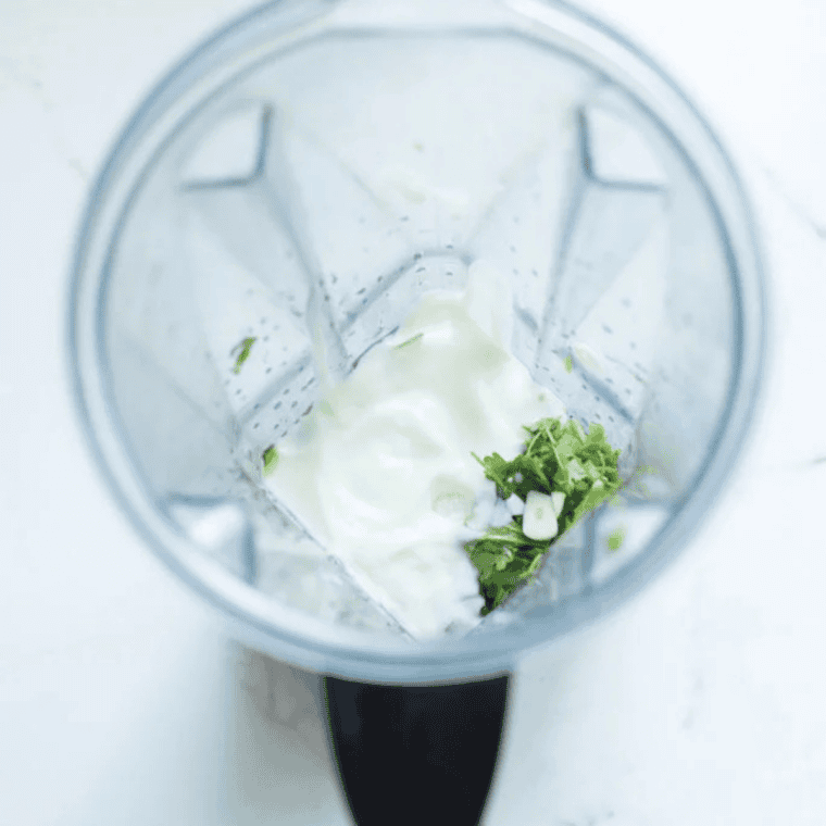 Whisk sour cream and fresh lime juice in white bowl
