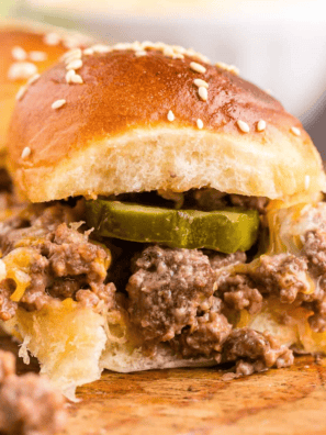 Air Fryer Black Currant Smashburger Sliders stacked on a wooden board with melted cheese, pickles, and special sauce