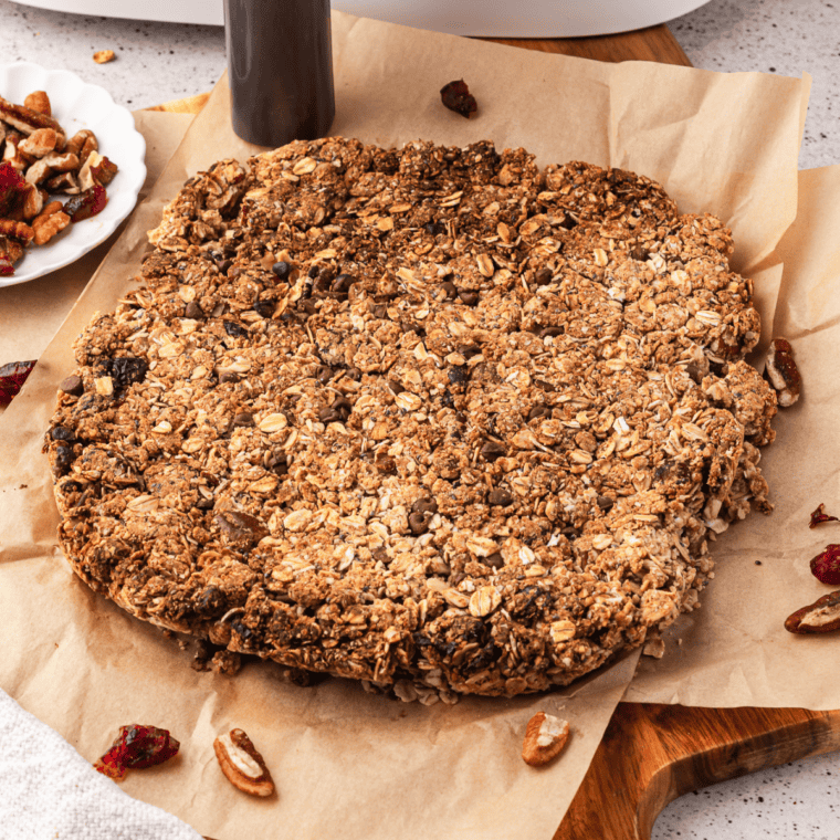 Golden granola toasting in the air fryer basket.