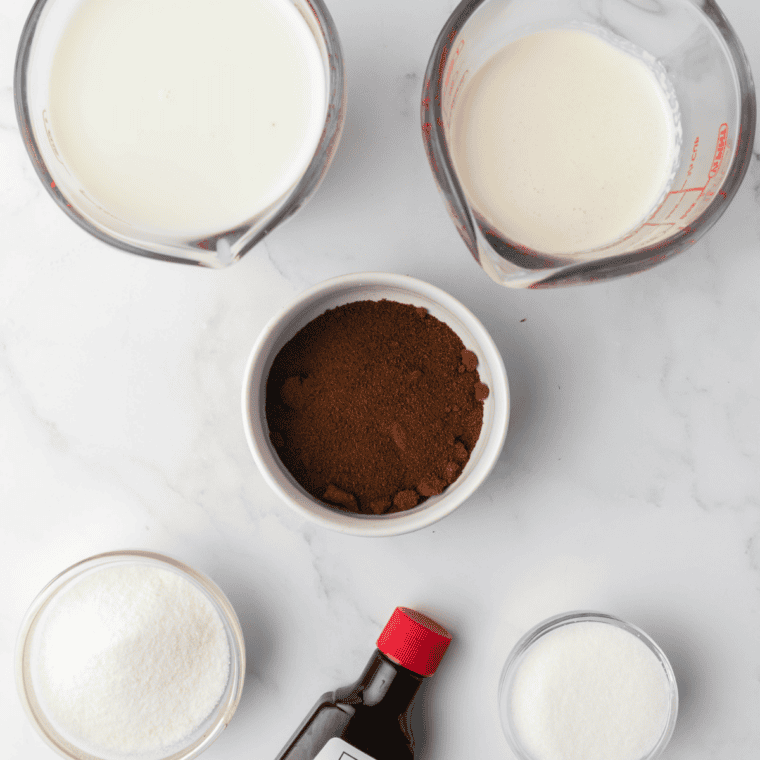 Ingredients for Ninja Creami coffee ice cream: milk, cream, sugar, espresso powder, and vanilla