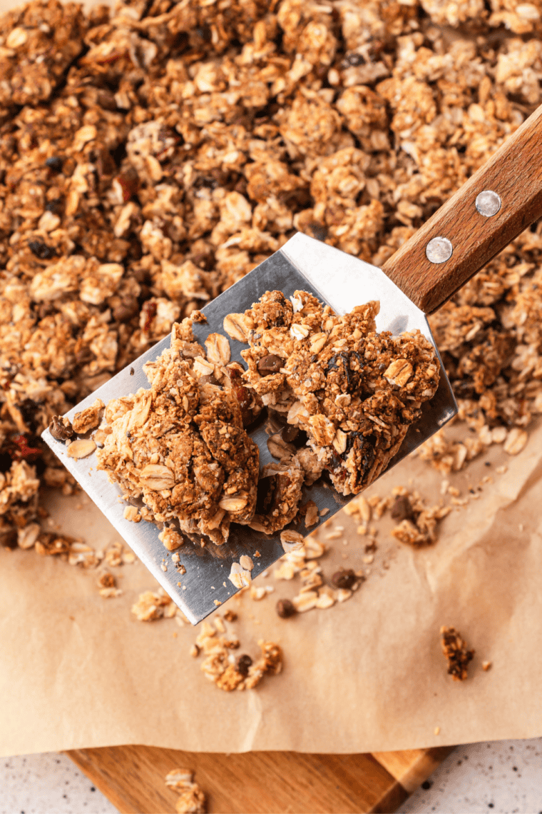 Copycat Bear Naked Maple Pecan Crumble granola in big clusters on a baking sheet