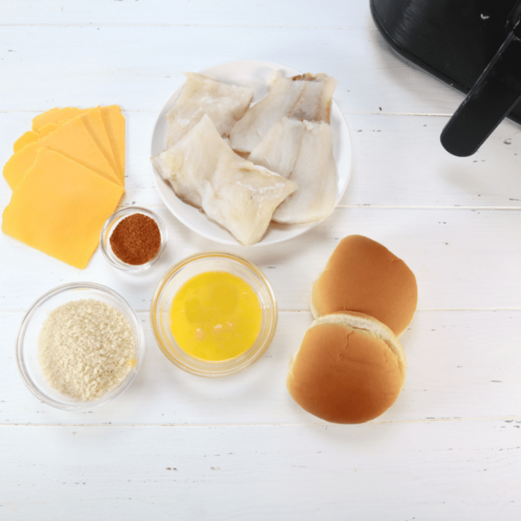 Ingredients needed for Copycat Burger King Fish Sandwich on kitchen table.