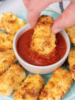 Burger King marinara sauce in a small dipping cup served with crispy mozzarella sticks