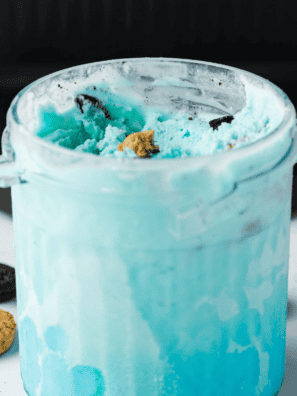 Scoops of pastel blue copycat Cold Stone cotton candy ice cream in a bowl, made in the Ninja Creami