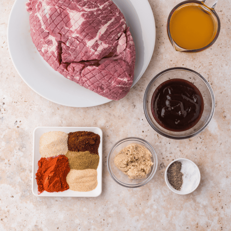 Ingredients for copycat Jack Daniel's pork rub measured in small bowls