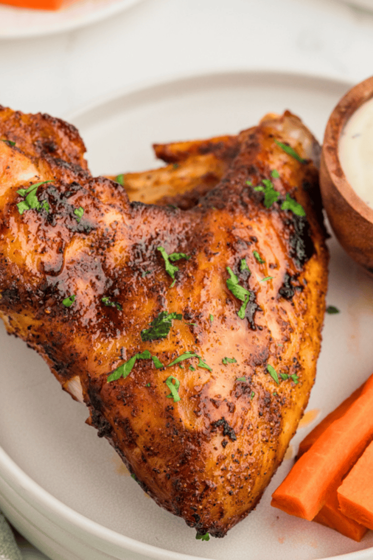 Baked chicken wings sprinkled with homemade Mrs. Dash seasoning and fresh parsley