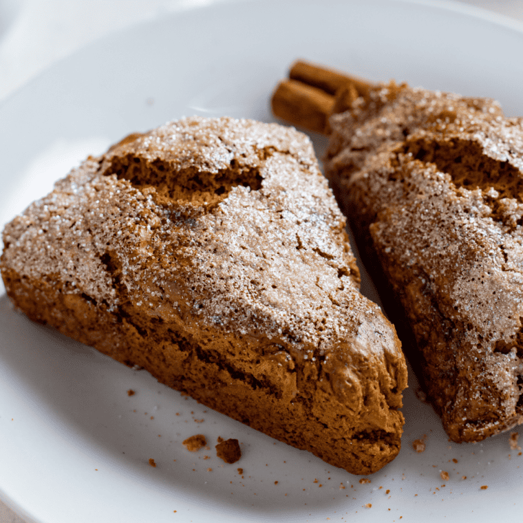 Glazed Copycat Starbucks Maple Oat Nut Scones stacked on a white plate.