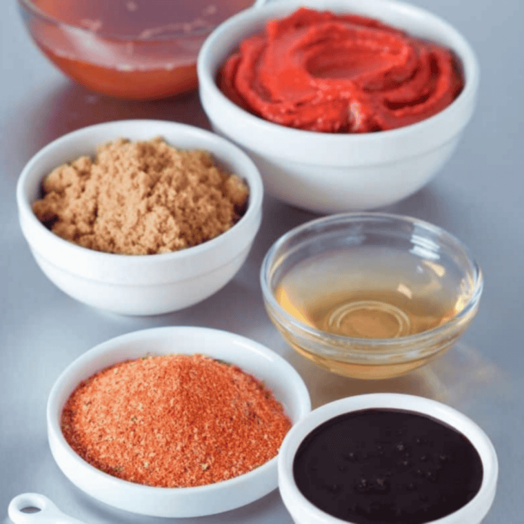 Ingredients for hickory bourbon barbecue sauce including molasses, bourbon, and spices