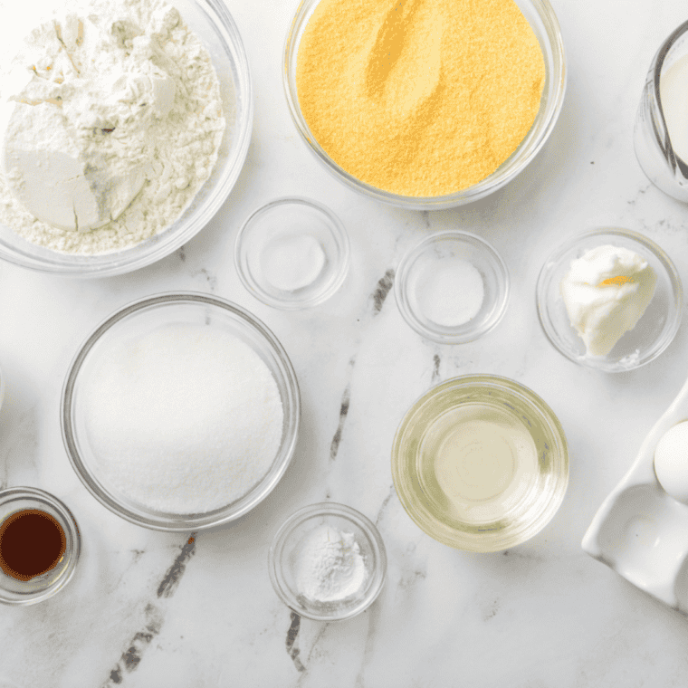 Flour, cornmeal, sugar, butter, eggs, milk, and honey for copycat Jason's Deli cornbread