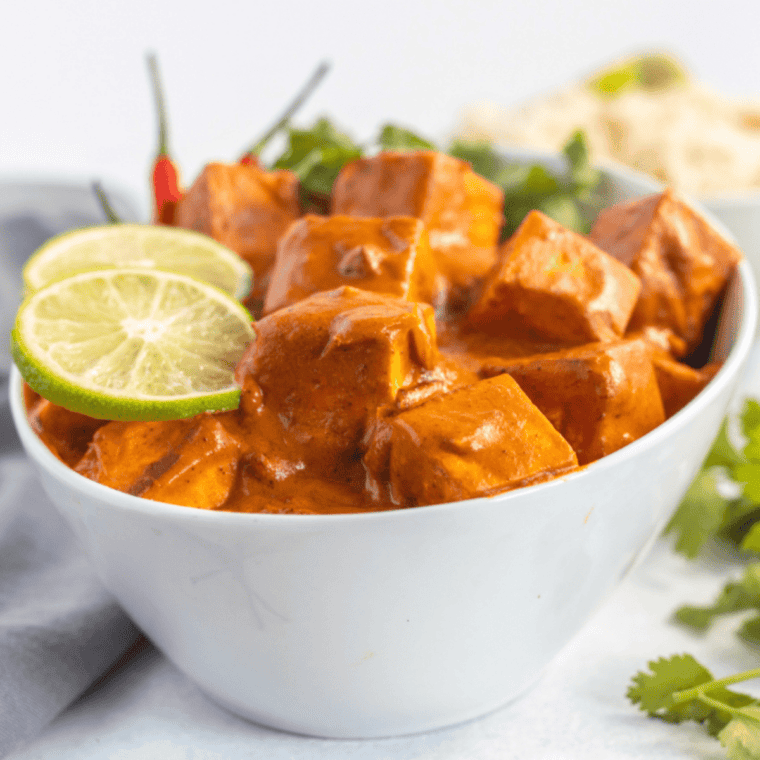Close-up of golden, crispy curry tofu cubes
