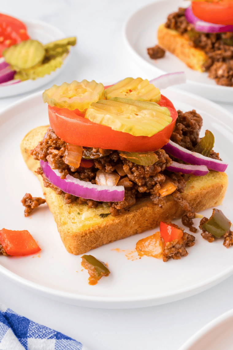 Sloppy joe seasoning, tomato sauce, and ketchup stirred into cooked ground beef
