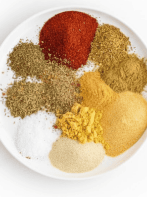 Homemade white chicken chili seasoning mix spices arranged on a white plate