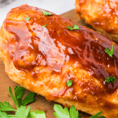 Jack Daniel's chicken breast glazed in sticky whiskey sauce, served over white rice with a sprinkle of green onions