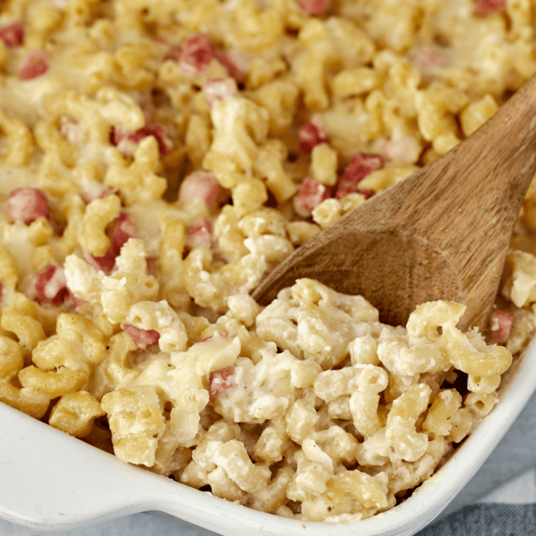 Close up of creamy Jack Daniel's mac and cheese with golden crust and bacon