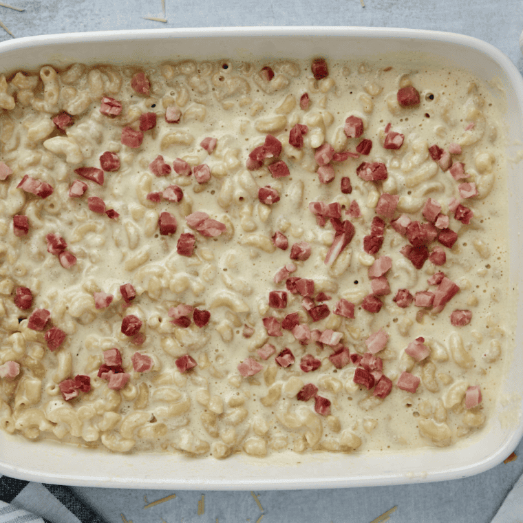 Cooked macaroni stirred into the smoky whiskey cheese sauce