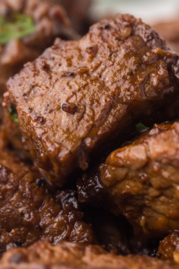 Tender steak bites made in the Ninja Crispi air fryer with garlic butter and parsley.