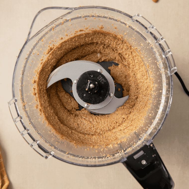Smooth glossy almond butter in a food processor