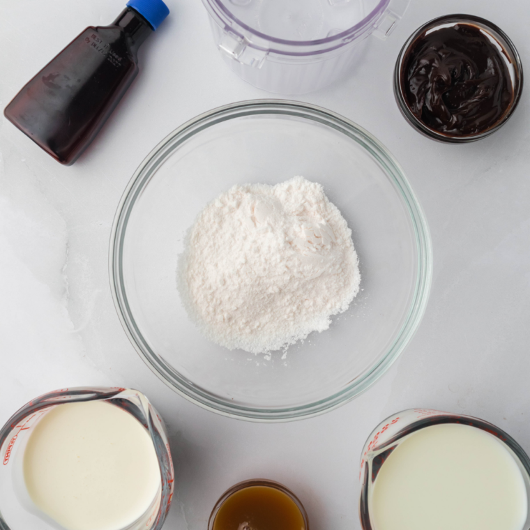 Ingredients for Ninja Creami Blue Bell Chocolate Lava Cake ice cream: heavy cream, whole milk, sugar, vanilla, chocolate cake pieces, and fudge sauce.