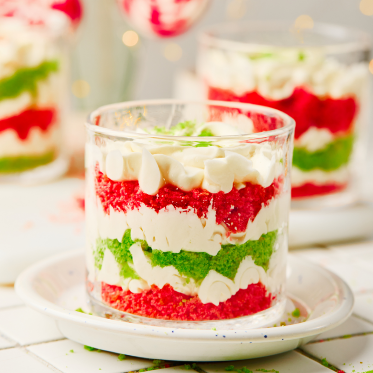 Close-up of red and green Christmas trifle layers in a clear glass bowl