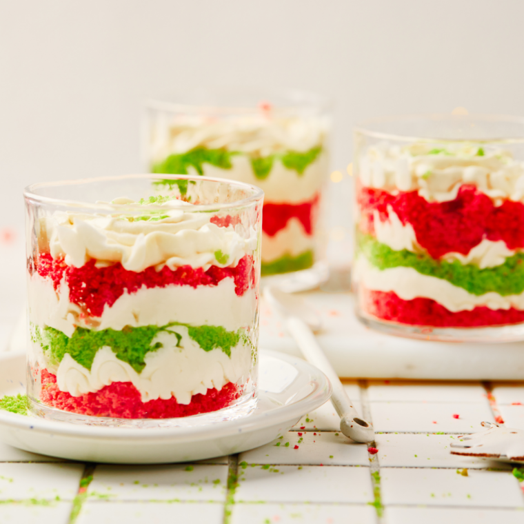 Individual Christmas trifle desserts layered in small mason jars