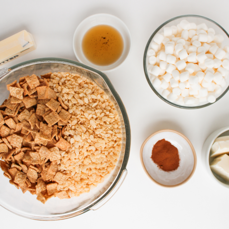 Ingredients for cereal bars: butter, marshmallows, vanilla, Rice Krispies, Cinnamon Toast Crunch, white chocolate melts