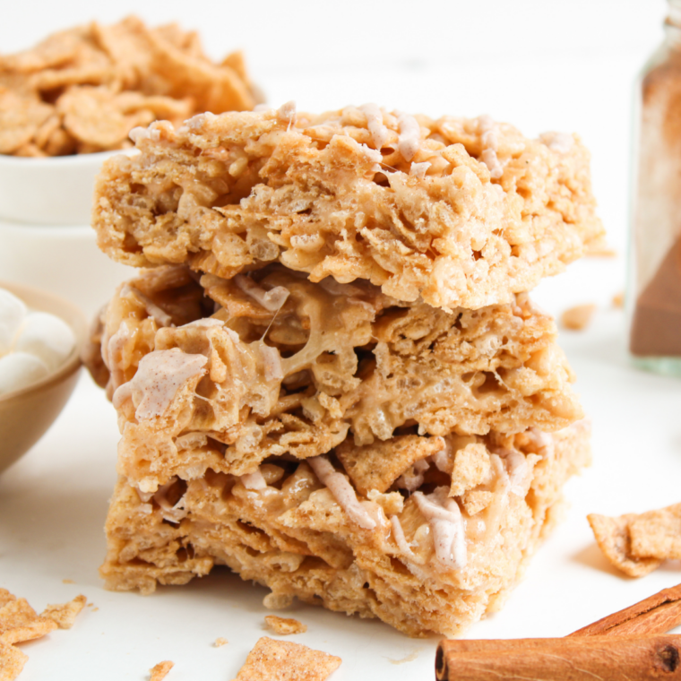 Stack of three cereal bars showing chewy marshmallow and crunchy topping