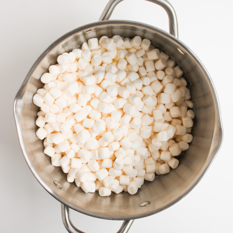 Mini marshmallows melted into a smooth glossy mixture with a rubber spatula