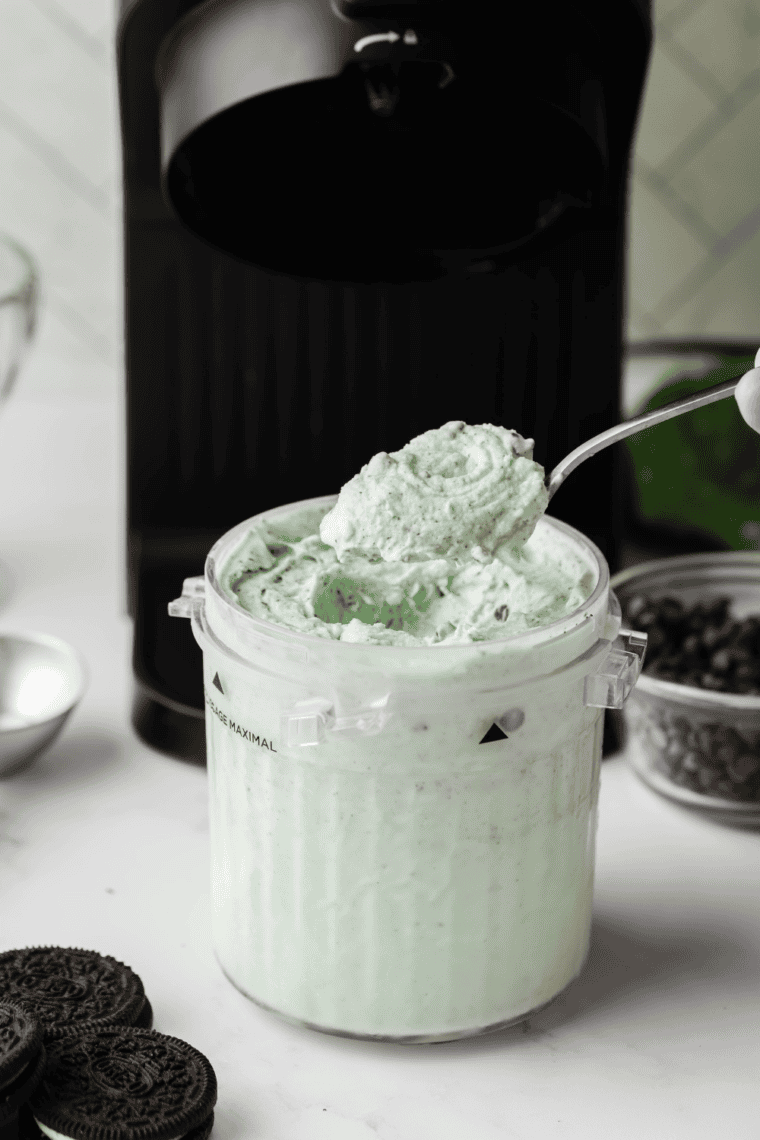 Crumbly powdery mint ice cream in a Ninja Creami pint after the first spin