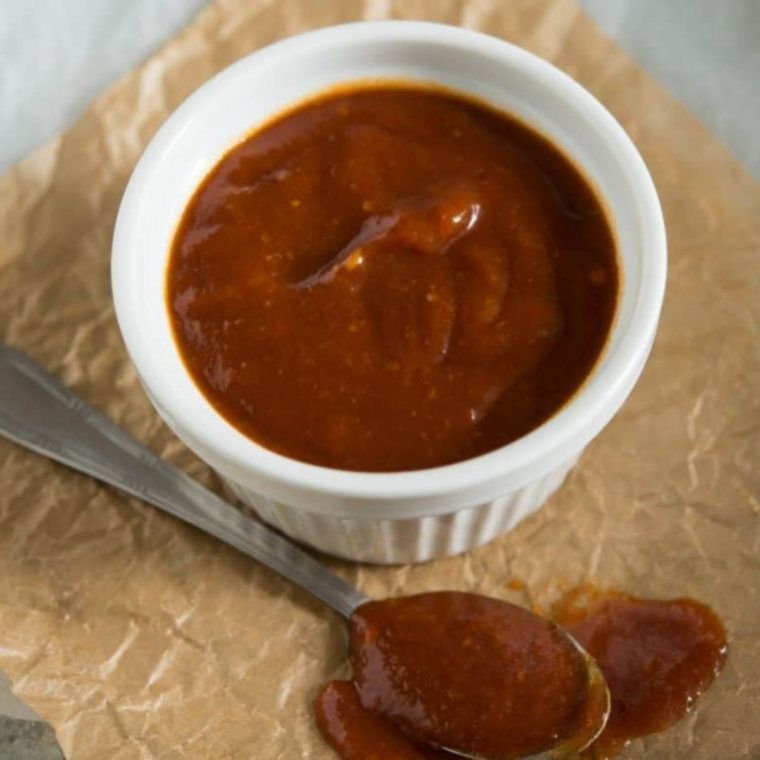 Homemade Japanese barbecue sauce warming over low heat, glossy and smooth with no bubbles at the pan edge