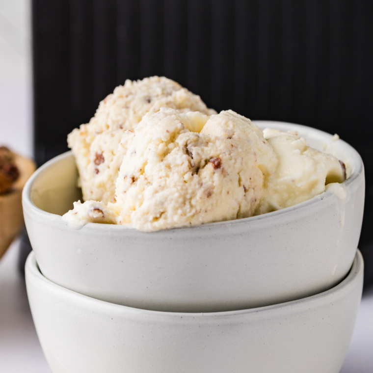 Bowl of Ninja Creami butter pecan ice cream topped with toasted pecans