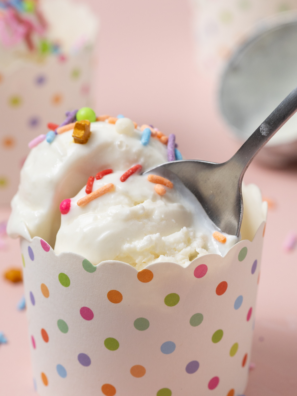 Scoop of copycat Culver's frozen custard in a glass dish with a spoon